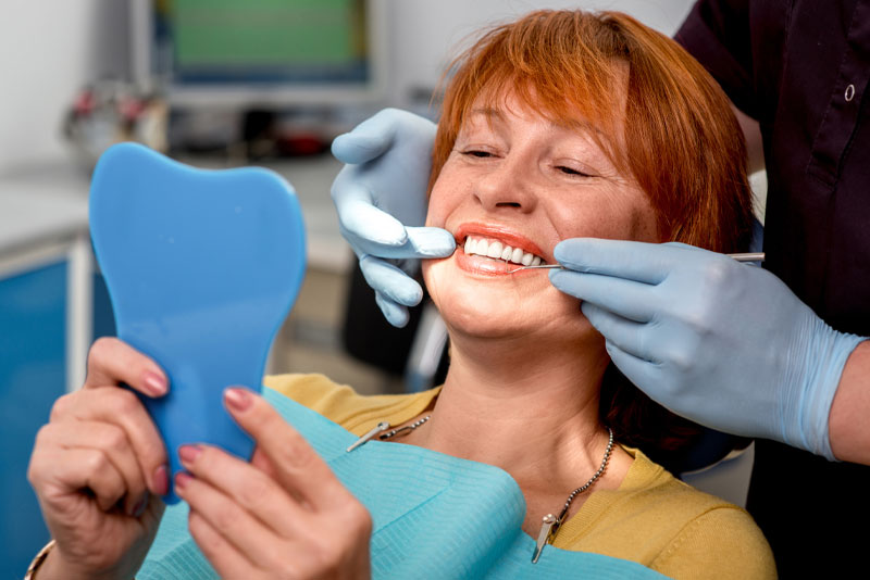 dental patient undergoing supported dentures procedure
