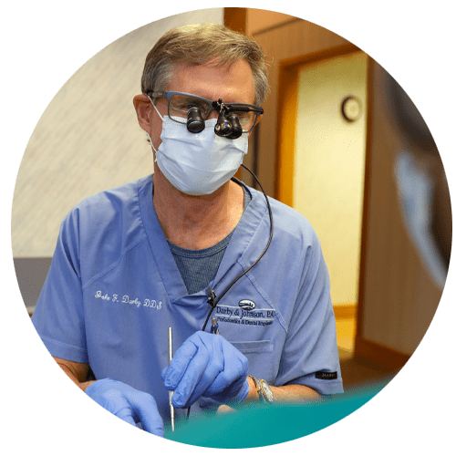dr darby performing dental implants procedure