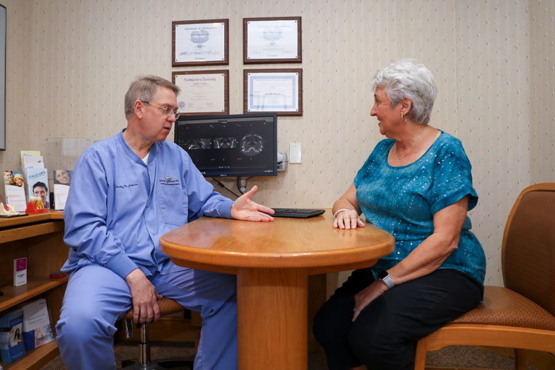 dr johnson discussing full mouth dental implants